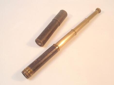 A 19thC three draw brass telescope with leather grip and cloth-bound case.Estimate: 30-40