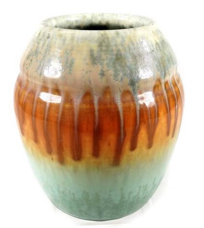 A Ruskin Pottery 1931 vase, of bulbous form with drip ware decoration, in orange, green and cream, impressed and signature marks beneath, 19cm H.