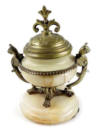 A Grand Tour style alabaster inkwell, with brass mounts, animal handles and pierced fleur des lys style knob, on quadruple supports, terminating in a plinth base, 15cm H.