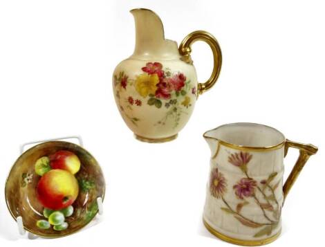 A 20thC Royal Worcester fruit pattern saucer, handpainted with apples and grapes, unsigned, 7cm Dia., a small ivory floral pattern jug and a further bark style jug. (3)