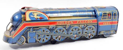 A child's tin plate Golden Falcon locomotive no. 6681, battery operated with articulated wheels, 41cm W.