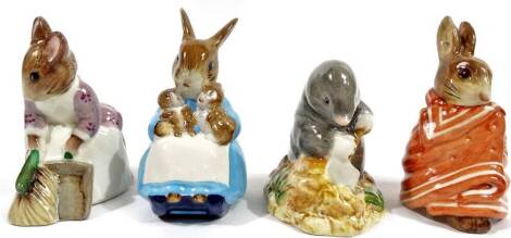 Various Beswick Beatrix Potter figures, comprising Poorly Peter Rabbit, 10cm W, Hunca Munca Sweeping, Mrs Rabbit and Bunnies and Diggory Diggory Delvet, printed marks beneath. (4)