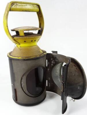 An early 20thC British Rail lantern, in yellow and black colour way, of cylindrical form, with front glass and fixed handle, 29cm H. - 3