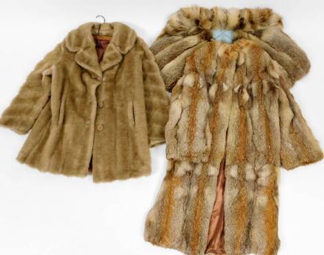 Two various ladies fur coats, one three quarter length, the other quarter length and a matching cape. (3)