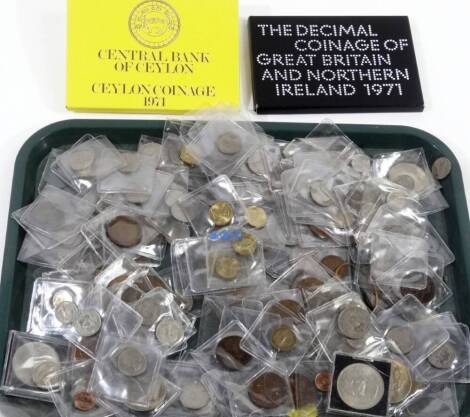 A Decimal Coinage of Great Britain and Northern Ireland 1971 set, a Ceylon Coins 1971 set, a quantity of various world used coins, 1922 dollar, various GB used, threepenny bits, other pre-decimal, Guernsey 1966 five shilling, world coins, etc. (a quantit