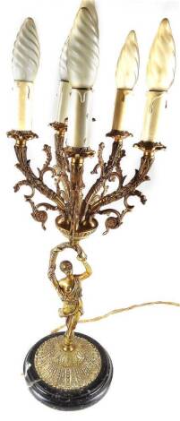 A gilt metal table lamp, with five branches set with mock candles, on entwined floral stems, above a figure stem, on a domed marble finish base, 62cm H.