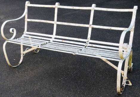 A Victorian wrought iron bench, partially slatted, with shaped back, scroll arms and shaped legs, painted white, 78cm H, 149cm W, 70cm D.