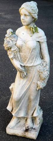 A classical concrete statue of a lady, in flowing robes holding bouquets of flowers, on a shaped base, 112cm H.