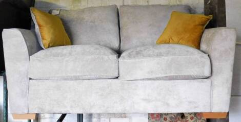 An ex-display Nebraska two seater settee, 97cm H, 181cm W, 98cm D, with associated cushions.