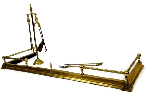 A brass fireside companion set, with shovel, poker, etc. on stand, 76cm H, a D-end surround.