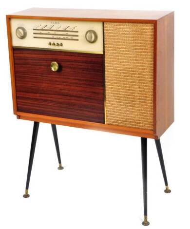 A Vintage Alba radiogram, with speaker front and articulated drawer, on turned ebonised legs terminating in metal disc feet, 87cm H, 72cm W, 22cm D.