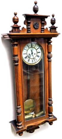 A late 19thC Gustav Becker walnut cased Vienna wall clock, of rectangular form, with urn and sun patera finial, quarter columns and gadrooned under section, with a three part glazed case housing a 19cm Dia. Roman numeric dial marked GB, with subsidiary Ar