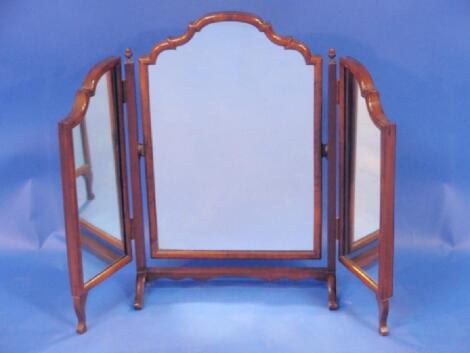 A walnut framed triple dressing table mirror in the Queen Anne style