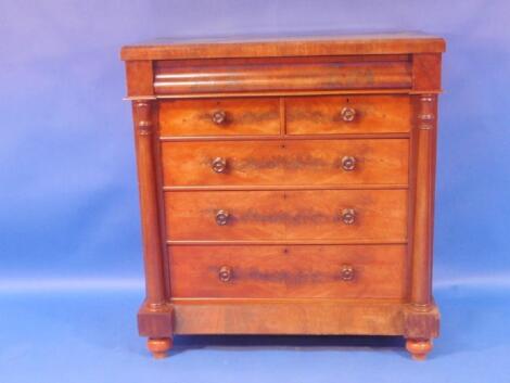 A Victorian flamed mahogany Scotch chest with scroll drawer over two short