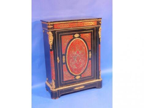 A Napoleon III ebonised pier cabinet with premier partie Boulle decoration