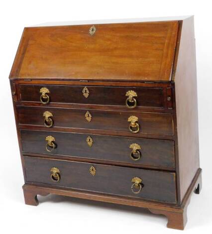 A George III mahogany bureau, the fall revealing a fitted interior above loafers and four long cockbeaded drawers terminating in bracket feet, 100cm H, 52cm W, 51cm D.