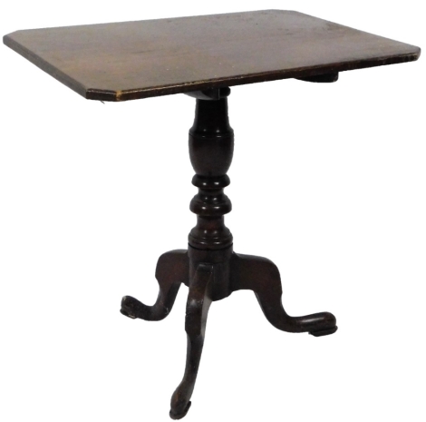 A late 18thC oak tilt top table, the canted rectangular top raised on a gun barrel stem terminating in triple cabriole legs, when raised 100cm H, 76cm W, 50cm D.