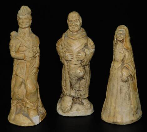 Three early 20thC terracotta figures, Robin Hood, 13cm H, Maid Marian and Friar Tuck, possibly chess pieces, unmarked. (3)