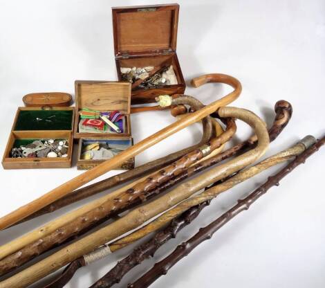 Various treen collectable, etc. various walking sticks to include a blackthorn type, 93cm W, a quantity of boxes containing mother of pearl gaming counters, WWII and other cap badges, part ribbons, pen knives, other bygones, collectables, a 19thC Sherato