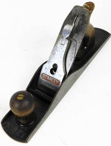 An early 20thC Stanley No.5 wood plane, with metal frame and wooden handle, 34cm W.