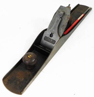 An early 20thC Stanley No.8 wood plane, with metal frame and wooden handle, 58cm W.