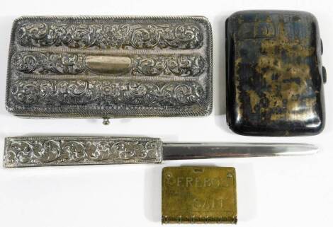 A shaped cigarette case, with mission type markings, 13cm W, a paper knife with heavy metal end, a Cerebos Table Salt brass advertising vesta case and a silver cigarette case. (4)