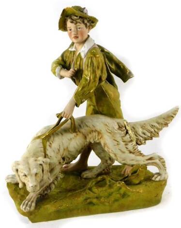 A late 19thC Royal Dux figure group, of a child leading large gun dog, on a naturalistic base, predominately in green and white with gilt highlights, raised pink triangle mark beneath, 47cm H. (AF)