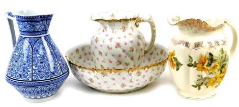 Various late Victorian pottery, a wash set comprising jug and bowl, 26cm high, floral pattern, another jug, blue and white example. (4)