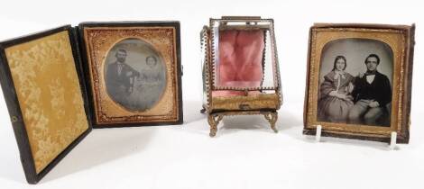 Two 19thC portrait daguerrotypes types, of an Edwardian lady and gentleman, and another similar, and a miniature metal framed jewellery casket, 8cm high. (3)