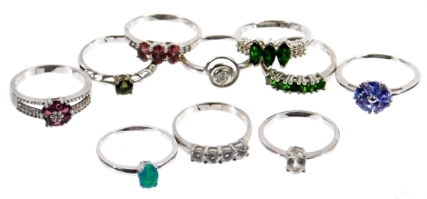 Ten modern silver dress rings, each stone set of varying designs, to include three stone design, single stone set rings, etc. (10)