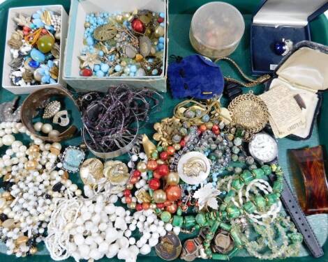 A quantity of costume jewellery and effects, to include scarf rings, dress rings, beaded necklaces, copper floral bangle, clip on earrings, enamel Paris bracelet, etc. (1 tray)