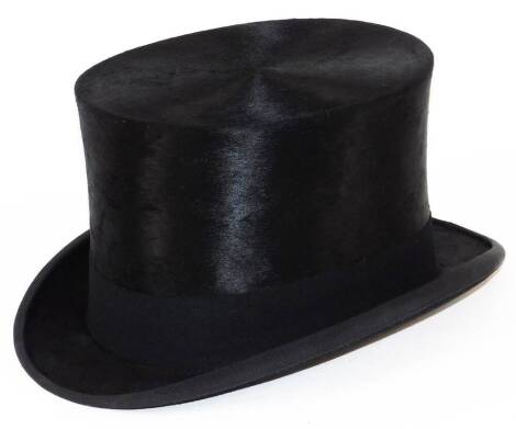 A 20thC Lock & Co top hat, in black with plain ribbon, interior measurements 22cm x 17cm. (boxed)