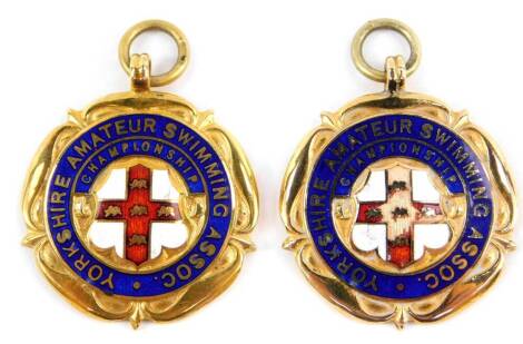 Two 9ct gold and enamel Yorkshire Amateur Swimming Association medals, verso engraved Ladies Diving Champ 1st and 2nd, Fattorini & Sons, cased, 25.2g.