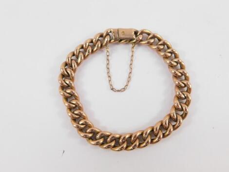 A 9ct rose gold curb link bracelet, on a snap clasp with safety chain as fitted, 16.9g.