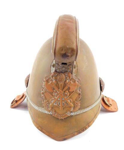 An early 20thC French brass fireman's helmet, lacking chin strap, interior re-lined, 24cm H.