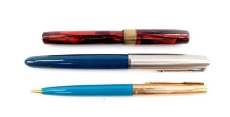 A Parker 61 gold plated propelling pencil, Parker fountain pen, Waterman's Ideal fountain pen, and a jar of Quink ink.