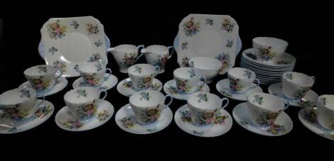 A Shelley porcelain tea service, Henley shape, printed with sprays of flowers, pattern no. 2351 printed and painted marks, comprising pair of cream jugs and sugar bowls, pair of bread plates, twelve teacups, saucers and tea plates.