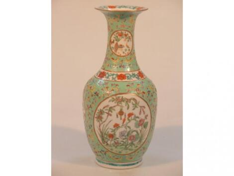 A Chinese baluster vase with enamelled decoration on a light green or turquoise