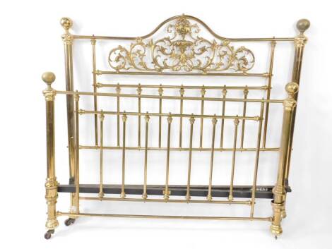 A Victorian style brass double bed frame, the headboard with pierced scrolling leaves and draping vines, no side irons.