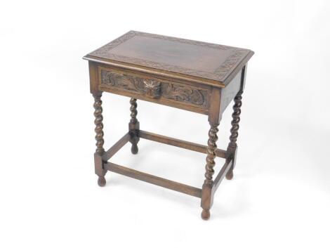 A Victorian oak side table, with a single frieze drawer carved with a tiger's head handle and scrolling leaves, raised on spiral twist legs, united by stretchers, 73cm H, 66cm W, 45cm D.