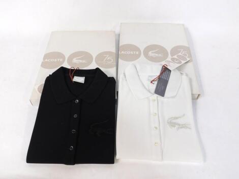 Five Lacoste rugby shirts, in black or white, boxed.