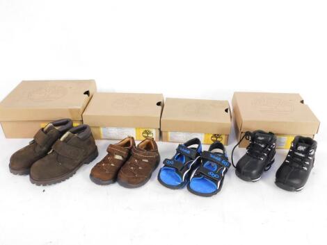 Eight pairs of Timberland Toddlers shoes, including brown Chukka Boots, dark brown Foothills, and black Splitlocks, sizes 5-10, boxed.