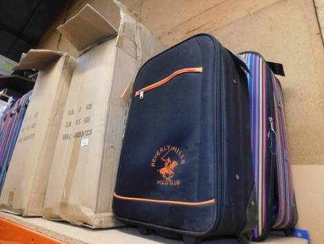 Three Beverly Hills multi stripe suitcases, and a Beverly Hills Polo Club back pack suitcase. (4)