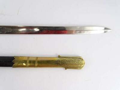 A late 19thC/ early 20thC naval sword, with brass and leather scabbard, the blade decorated a royal warrant, etc., the brass guard cast with an anchor motif and with a cream coloured shagreen handle, scabbard AF, 97cm L. - 3