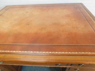 A late 19th/early 20thC mahogany partners desk in George III style, the rectangular top with a brown tooled leather inset and a moulded edge above an arrangement of drawers and panel doors on plinth base, 79cm H, the top 181cm x 135cm. Auctioneer announce - 2