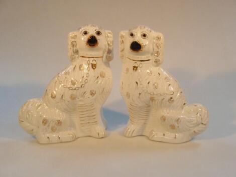 A pair of 19thC Staffordshire pottery spaniels