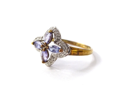 A 9ct gold dress ring, in floral design, set with four oval cut pale purple amethyst, surrounded by illusion set tiny diamonds, the ring size T½, 2.1g all in.