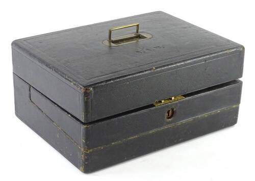 A 19thC leather writing slope, the hinged lid with incised monogram and sunken brass handle, enclosing a fitted interior with match holder, stationary rack, stamped Trussel, Brighton, 35cm W.