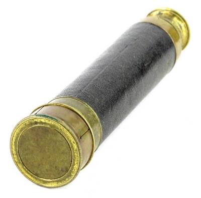 A late 19th/ early 20thC brass two draw telescope, with brass and leather, 20cm L.