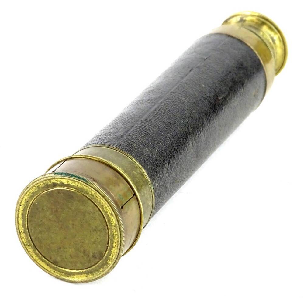 A late 19th/ early 20thC brass two draw telescope, with brass and leather,  20cm L.